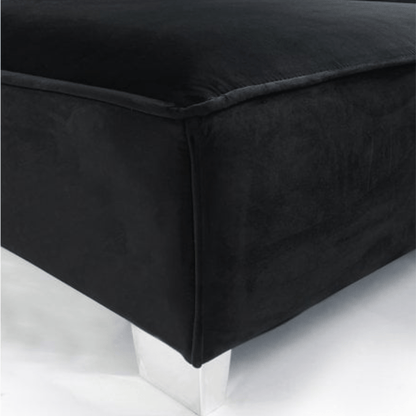Black upholstered ottoman on a white background