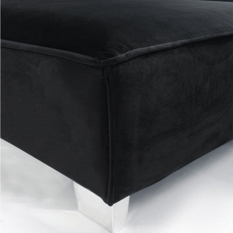 Black upholstered ottoman on a white background