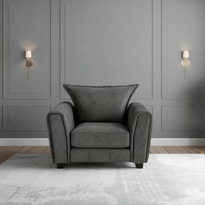 Somerford Grey Armchair front facing in a modern living room setting, grey fabric with soft upholstery and stylish design