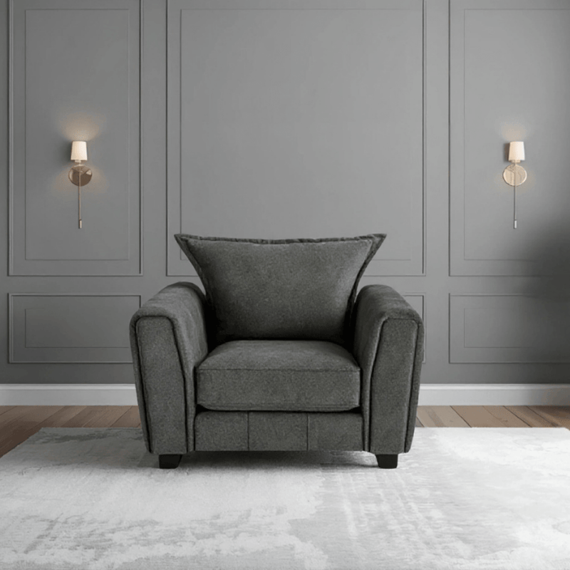 Somerford Grey Armchair front facing in a modern living room setting, grey fabric with soft upholstery and stylish design