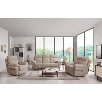 Beige sofa set in a modern living room with large windows.