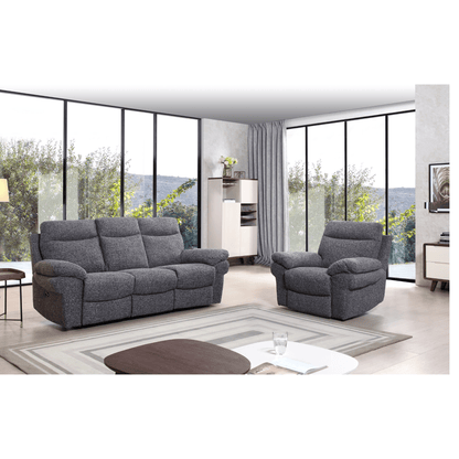 Gray sofa and armchair set in a modern living room with large windows.