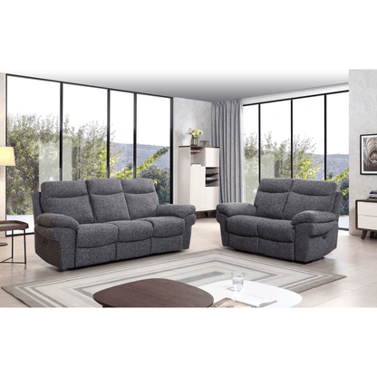 Gray sofa set in a modern living room with large windows.