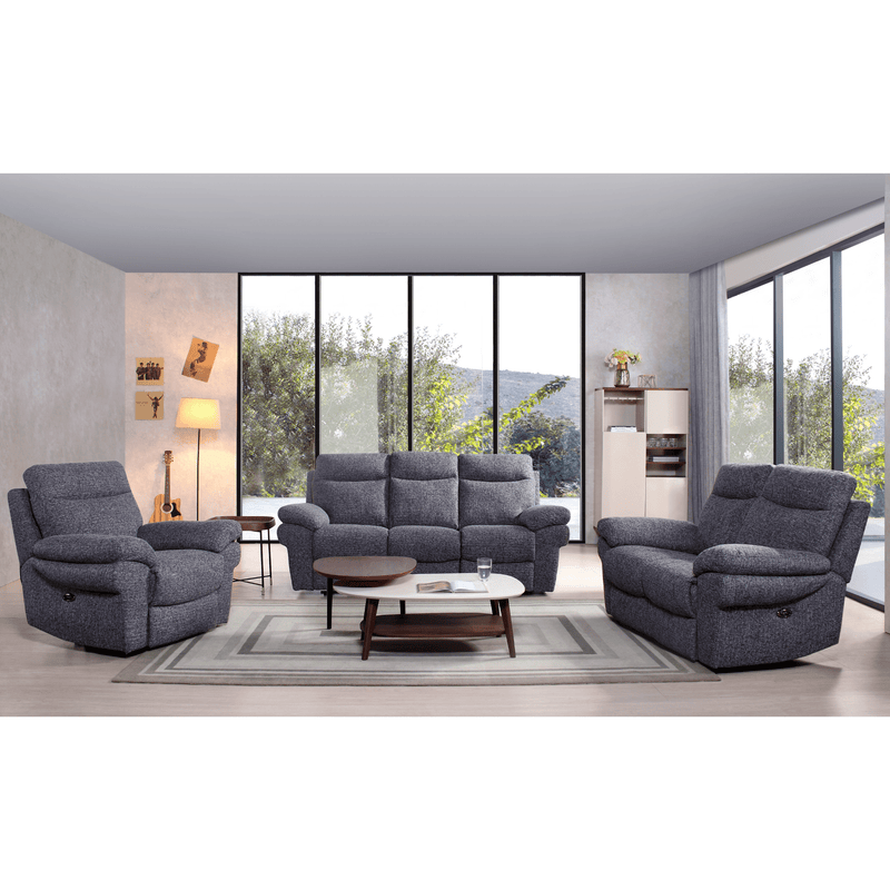 Gray sofa set in a modern living room with large windows.