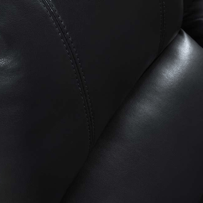 Close-up of black leather texture with visible stitching