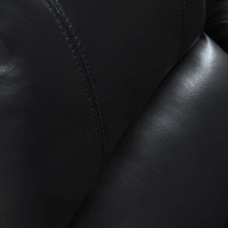 Close-up of black leather texture with visible stitching