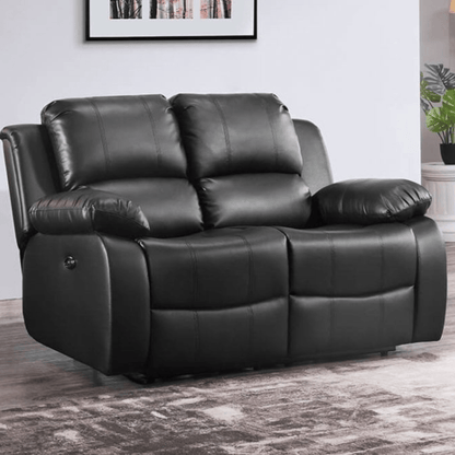 Black leather reclining sofa in a room with a plant and framed picture on the wall.