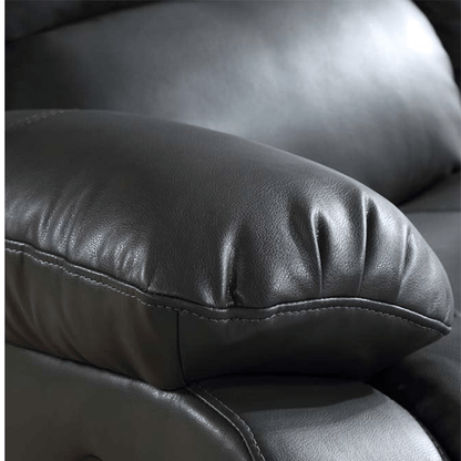 Close-up of a black leather armchair with visible stitching