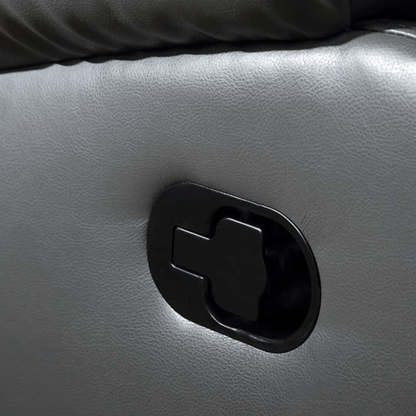 Close-up of a recliner handle on a leather sofa