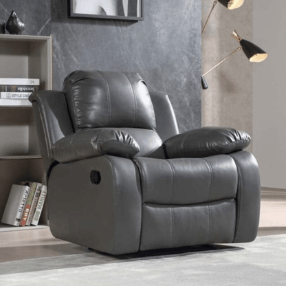 Gray recliner chair in a room with books and decor