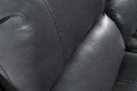 Close-up of a gray leather seat with visible stitching