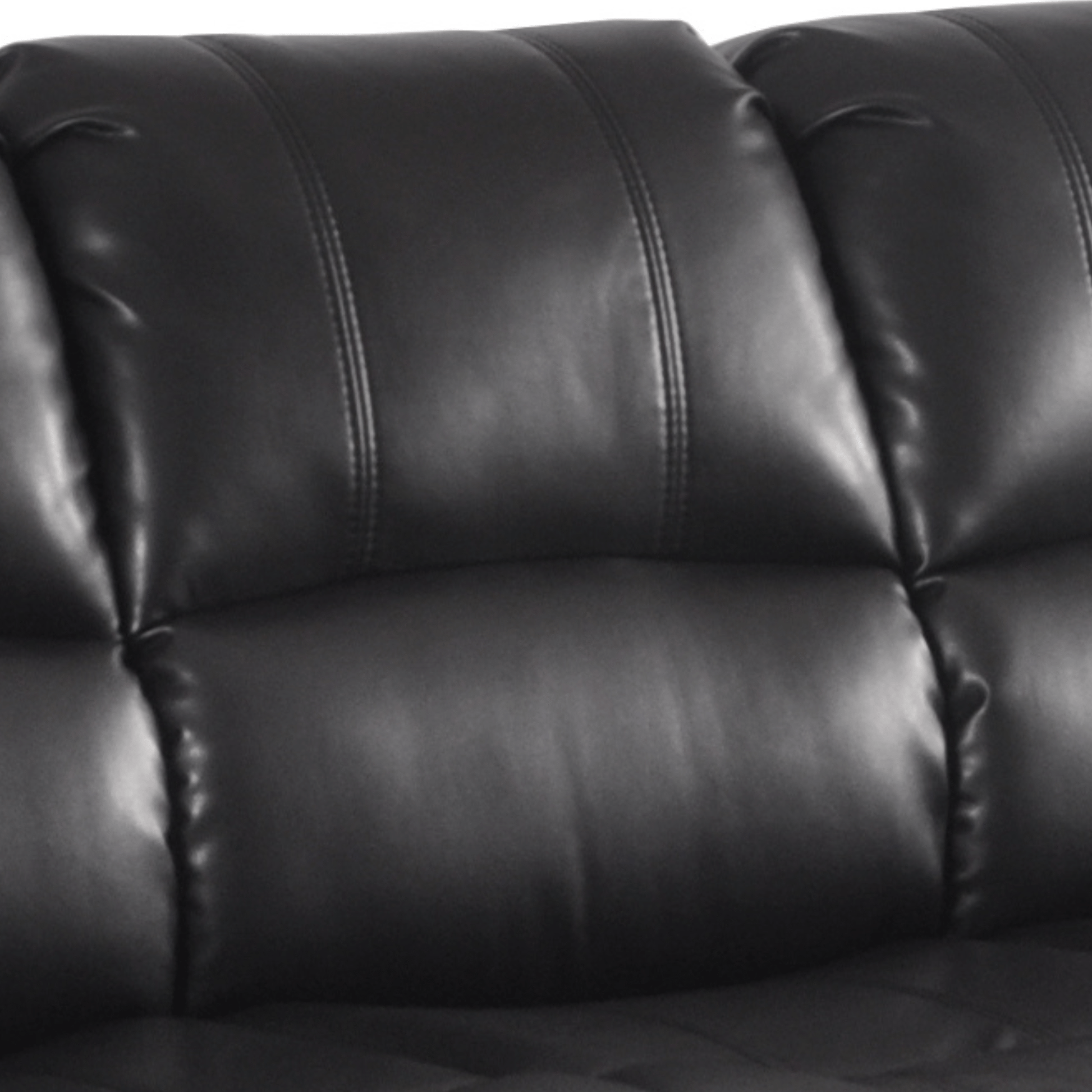 Close-up of a black leather sofa with visible stitching