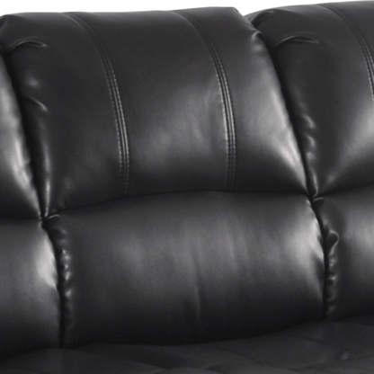 Close-up of a black leather sofa with visible stitching