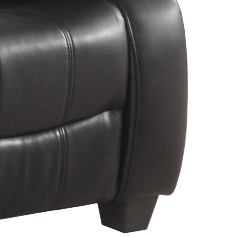 Close-up of a black leather armchair on a white background