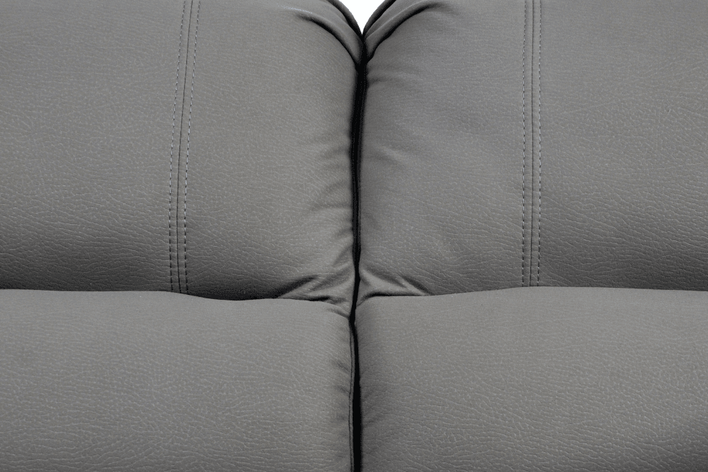 Close-up stitching of modern light grey fabric sofa – textured upholstery detail of contemporary living room furniture