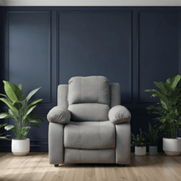 Gray armchair in a room with dark blue paneled walls and potted plants.