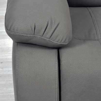 Gray fabric sofa with a close-up of a cushion on a wooden floor.