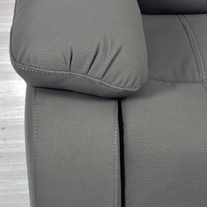 Gray fabric sofa with a close-up of a cushion on a wooden floor.