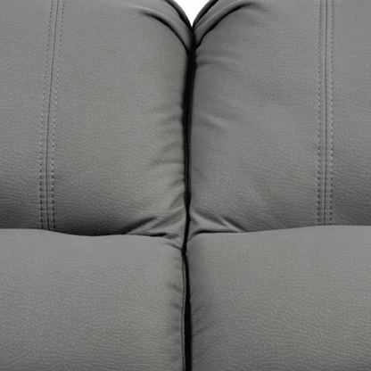 Close-up of a gray fabric sofa with visible stitching.