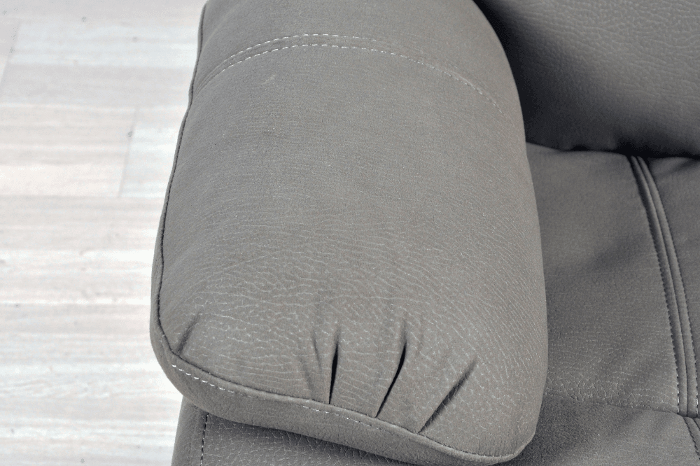 Close-up  arm view of modern light grey fabric sofa – textured upholstery detail of contemporary living room furniture