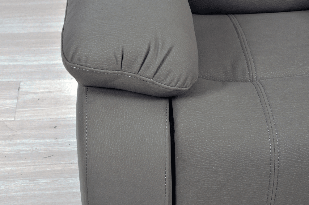 Close-up arm of modern light grey fabric sofa – textured upholstery detail of contemporary living room furniture