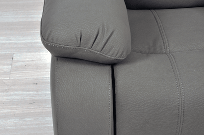 Close-up arm of modern light grey fabric sofa – textured upholstery detail of contemporary living room furniture