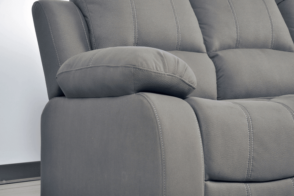 Close-up side view of modern light grey fabric sofa – textured upholstery detail of contemporary living room furniture