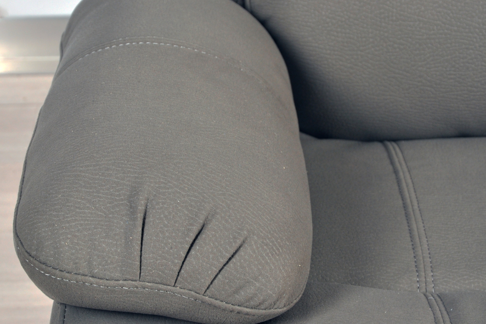 Close-up of modern light grey fabric sofa – textured upholstery detail of contemporary living room furniture