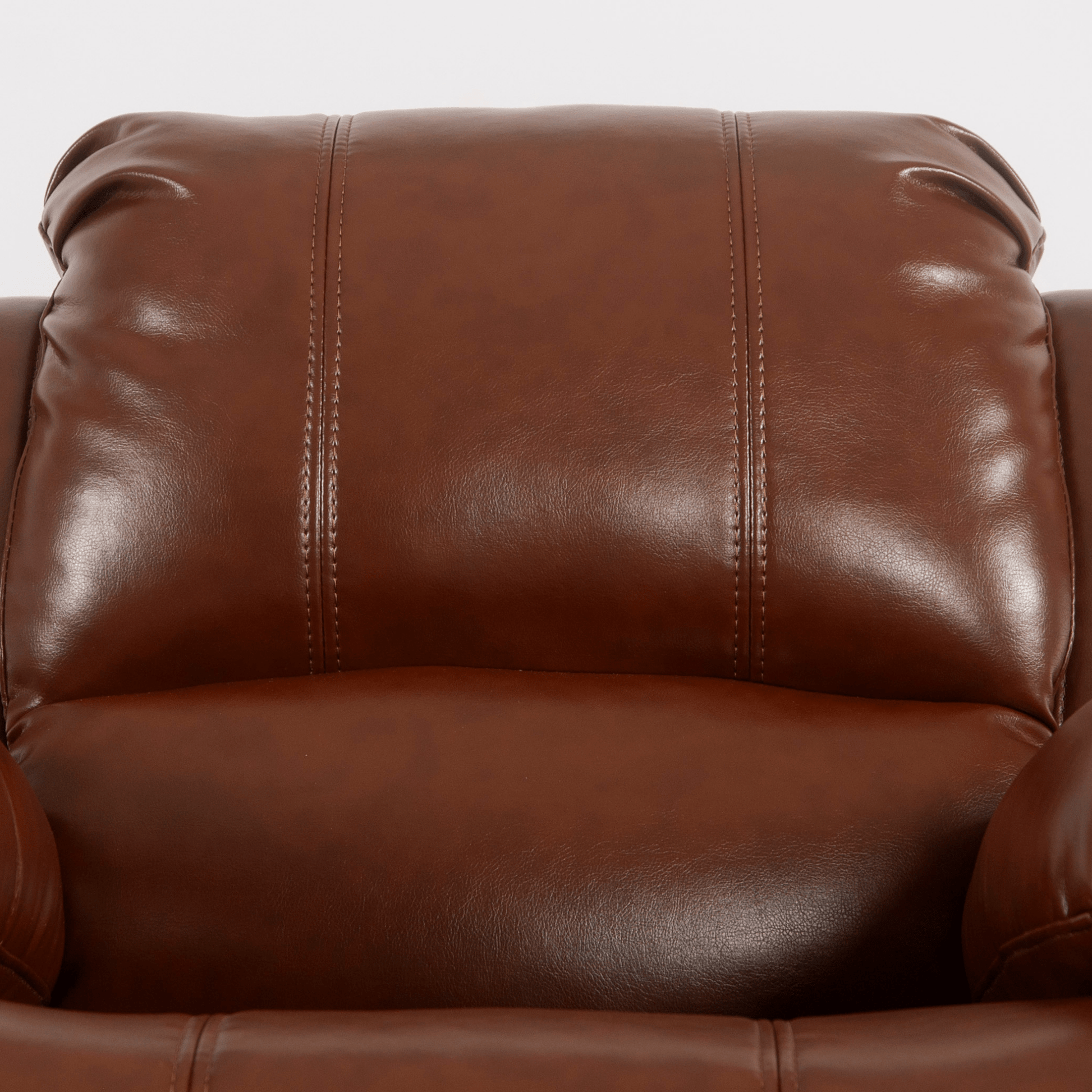 Close-up of a brown leather sofa with visible stitching.