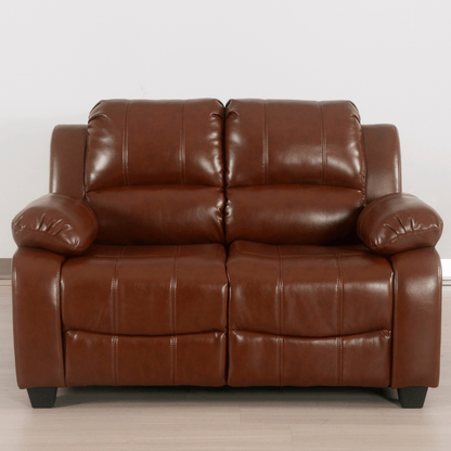 Brown leather sofa on a light wooden floor with a white wall background