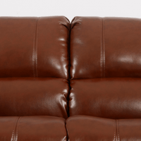 Close-up of a brown leather sofa with visible stitching.