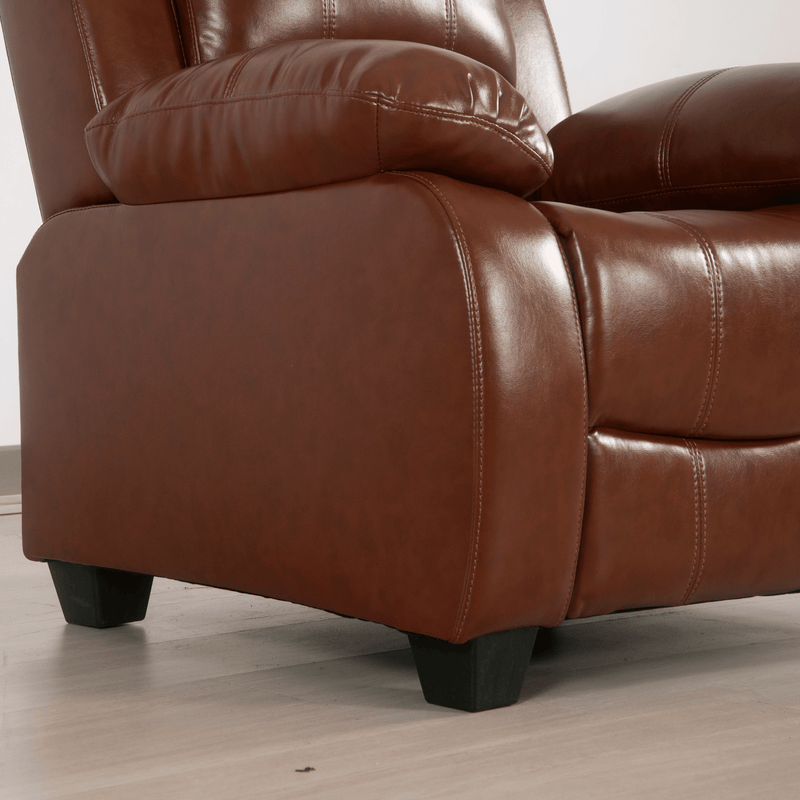 Brown leather recliner chair on a light wooden floor.