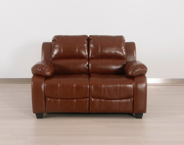 Full front view of the tan leather-Aire 2-seater sofa in a modern studio setting with a light wood floor.