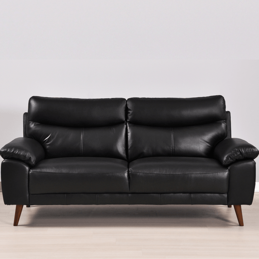 Vantage Black 3-Seater Sofa in a modern living room setting with stylish décor, soft lighting, and neutral tones