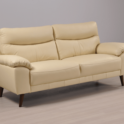 Angled view of the Vantage Cream 3-Seater Sofa in a modern living room setting with stylish décor and neutral tones