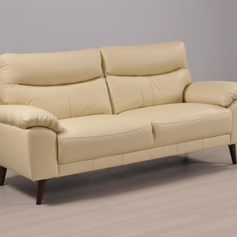 Angled view of the Vantage Cream 3-Seater Sofa in a modern living room setting with stylish décor and neutral tones