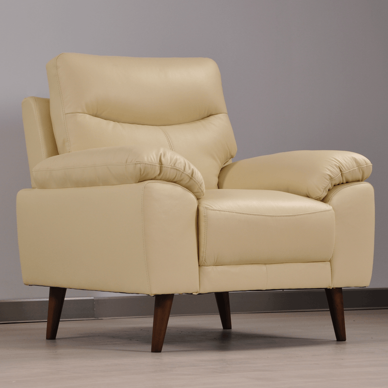Vantage Cream armchair in styled living room, angled view, modern and cozy seating arrangement