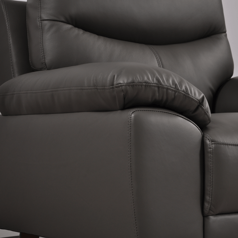 Vantage Grey Armchair close-up in living room set, highlighting fabric texture, cushions, and modern design details