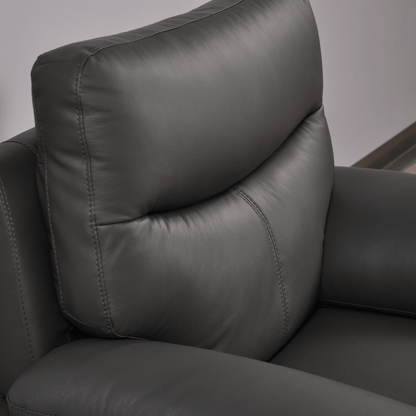 Vantage Grey Armchair close-up angled view in living room set, showcasing cushions, fabric texture, and modern design details