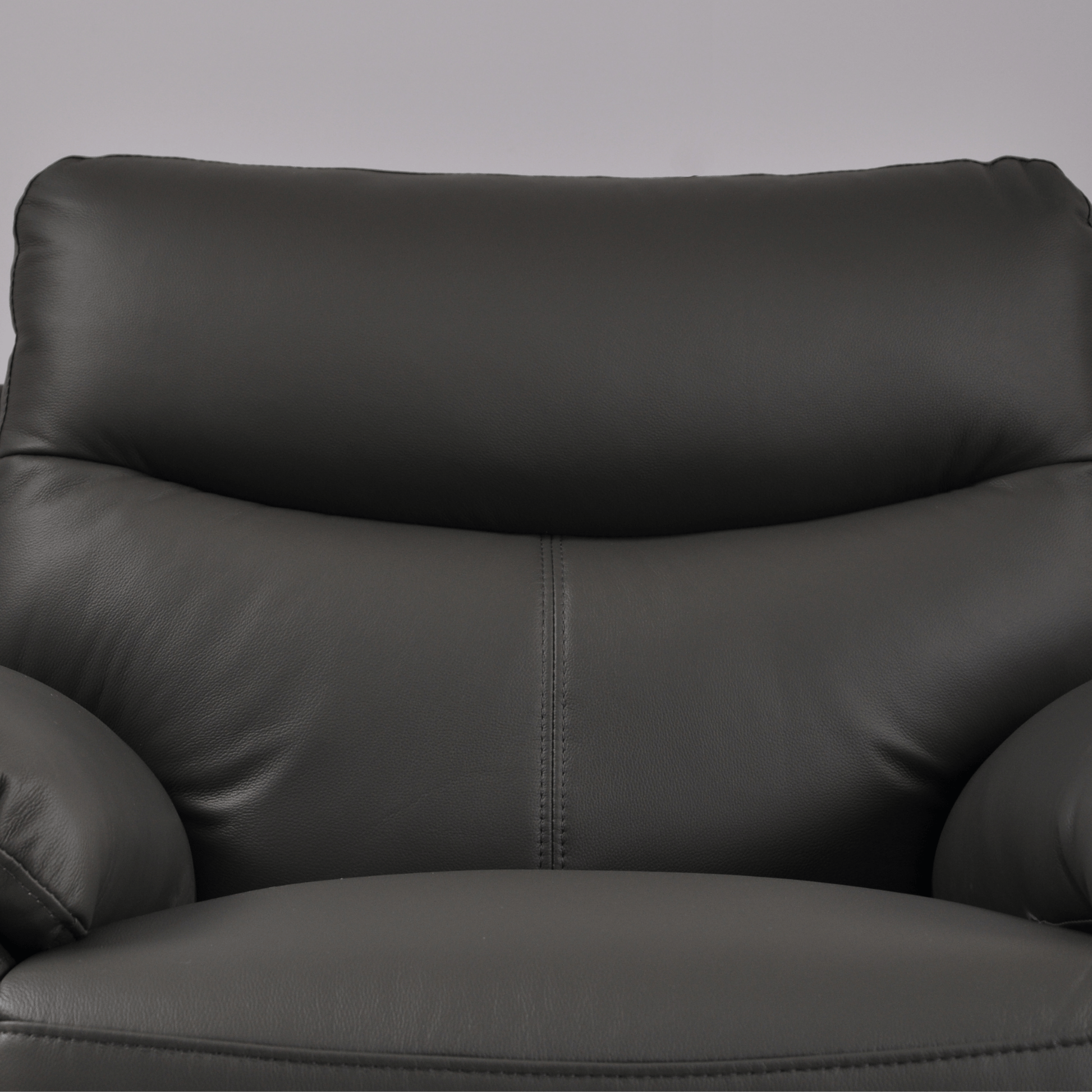 Vantage Grey Armchair close-up in living room set, highlighting fabric texture, cushions, and modern design details