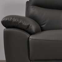 Vantage Grey Armchair close-up in living room set, highlighting cushions, fabric texture, and modern design details