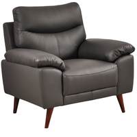 Vantage Grey Armchair angled view on white background, showing cushions, clean lines, and modern design details