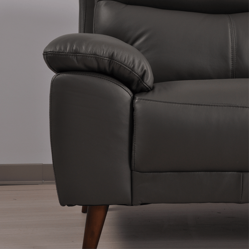 Vantage Grey Armchair close-up in living room set, highlighting fabric texture, cushions, and modern design details