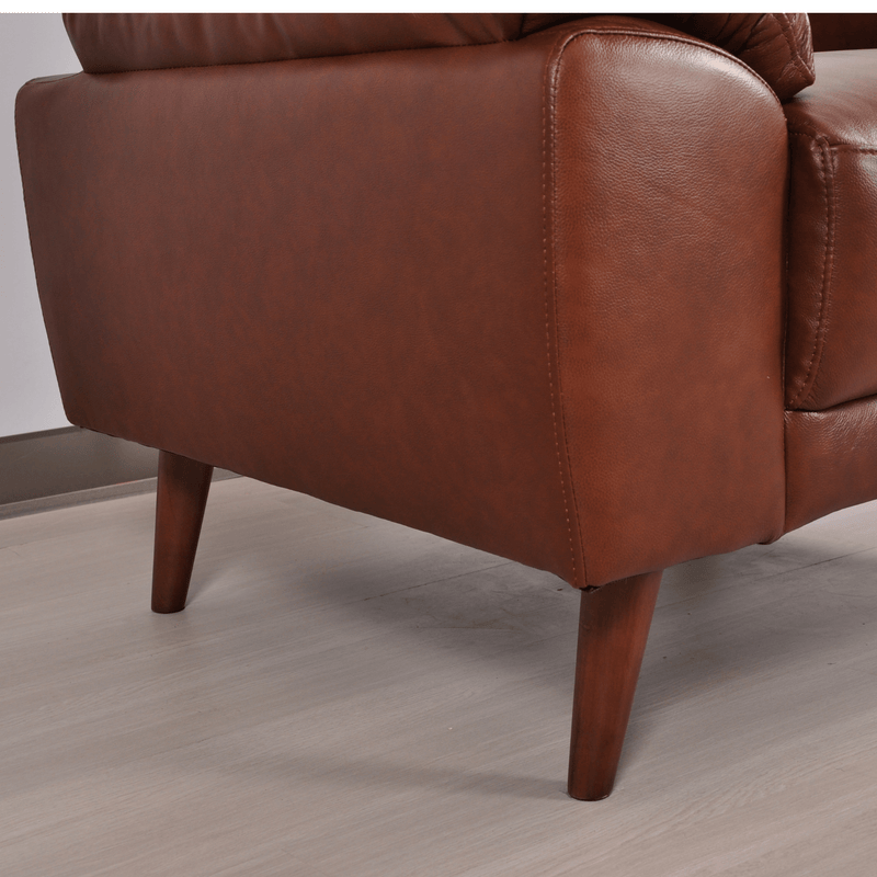 Close-up of Vantage tan armchair highlighting its plush cushions and modern design