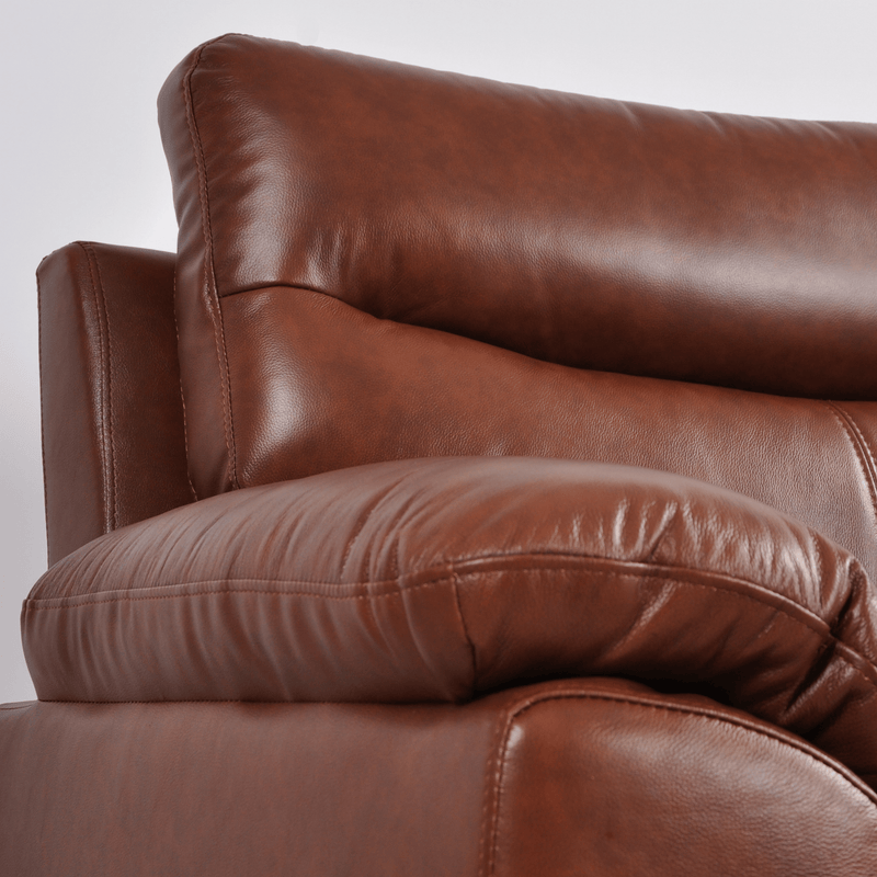 Close-up of Vantage tan armchair showing plush cushions, soft fabric, and sleek modern design