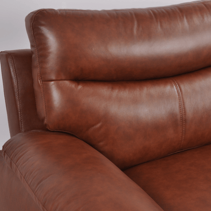 Close-up of Vantage tan armchair showing cushioned seat, soft fabric, and sleek modern design