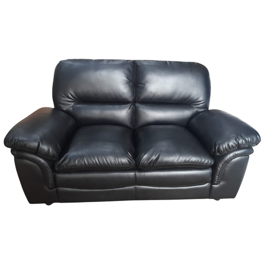 Black leather sofa on a white background