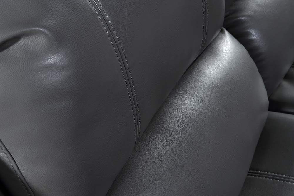 Close-up of black leather sofa on white background – modern luxury furniture with premium leather upholstery