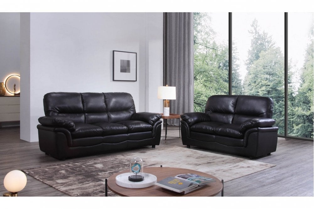 Black leather 3+2 seater sofa in stylish living room setting – modern interior design with premium leather furniture