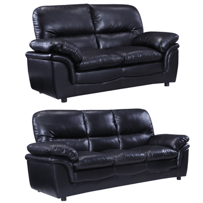 Two black leather sofas on a white background